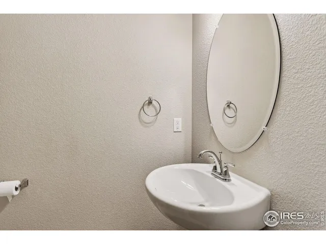 a bathroom with a sink and mirror