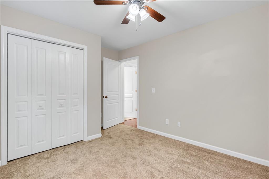429 Arrowhead Trail Canton, GA 30114 - Photo 14 of 25 an empty room with chandelier fan