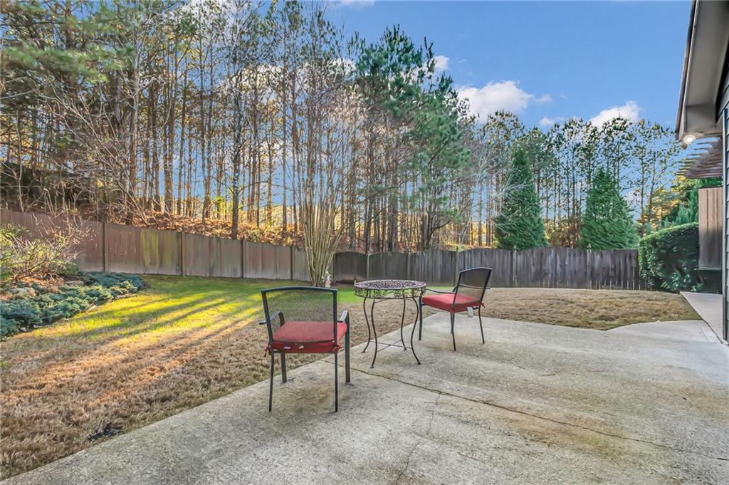 429 Arrowhead Trail Canton, GA 30114 - Photo 24 of 25 a backyard of a house with table and chairs