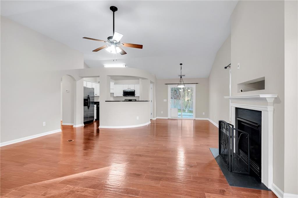 429 Arrowhead Trail Canton, GA 30114 - Photo 4 of 25 a view of an empty room with window and fireplace