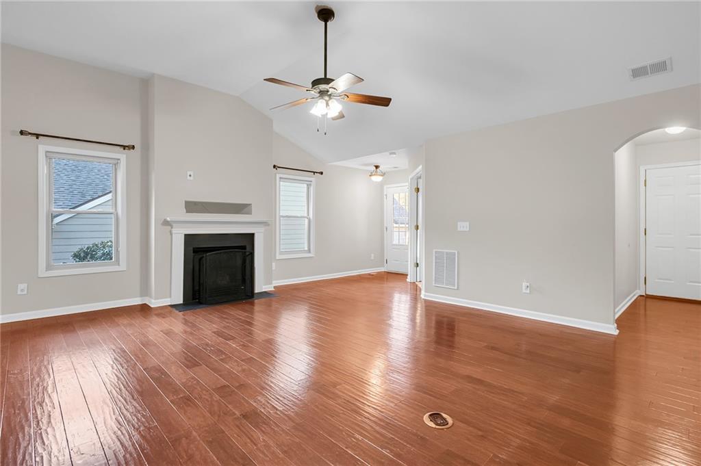 429 Arrowhead Trail Canton, GA 30114 - Photo 6 of 25 a view of empty room with wooden floor and fireplace