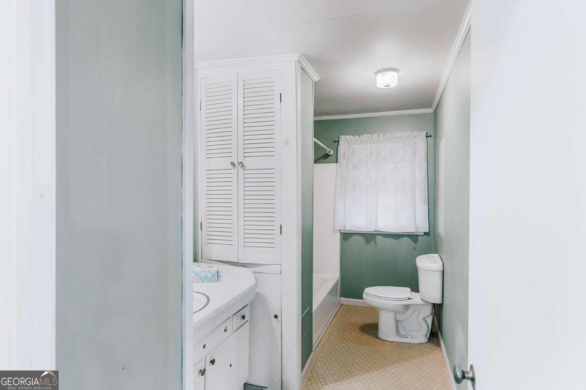119 Ralph Bridges Road Lexington, GA 30648 - Photo 30 of 65 a bathroom with a sink a toilet and shower