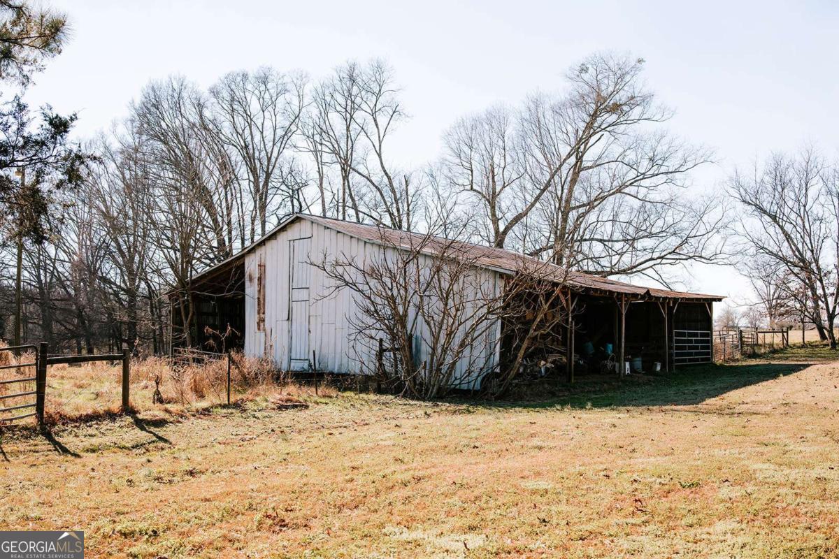 119 Ralph Bridges Road Lexington, GA 30648 - Photo 37 of 65 a view of a house with a snow in the yard