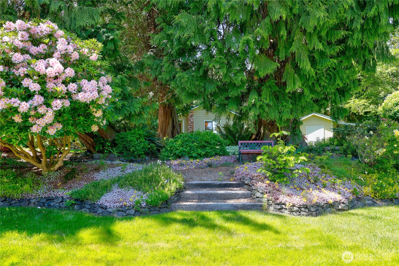252 Jansen Road Nordland, WA 98358 - Photo 27 of 40 a front view of a house with a yard and fountain in middle