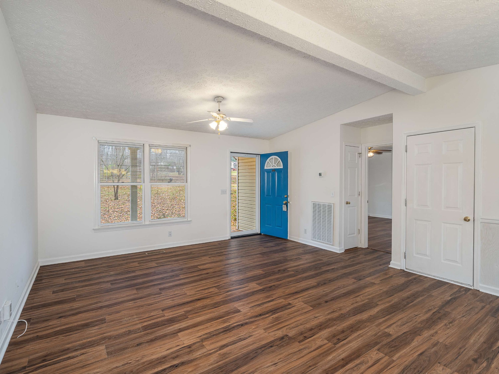 7125 Sutton Place Fairview, TN 37062 - Photo 11 of 36 a view of an empty room with wooden floor and a window