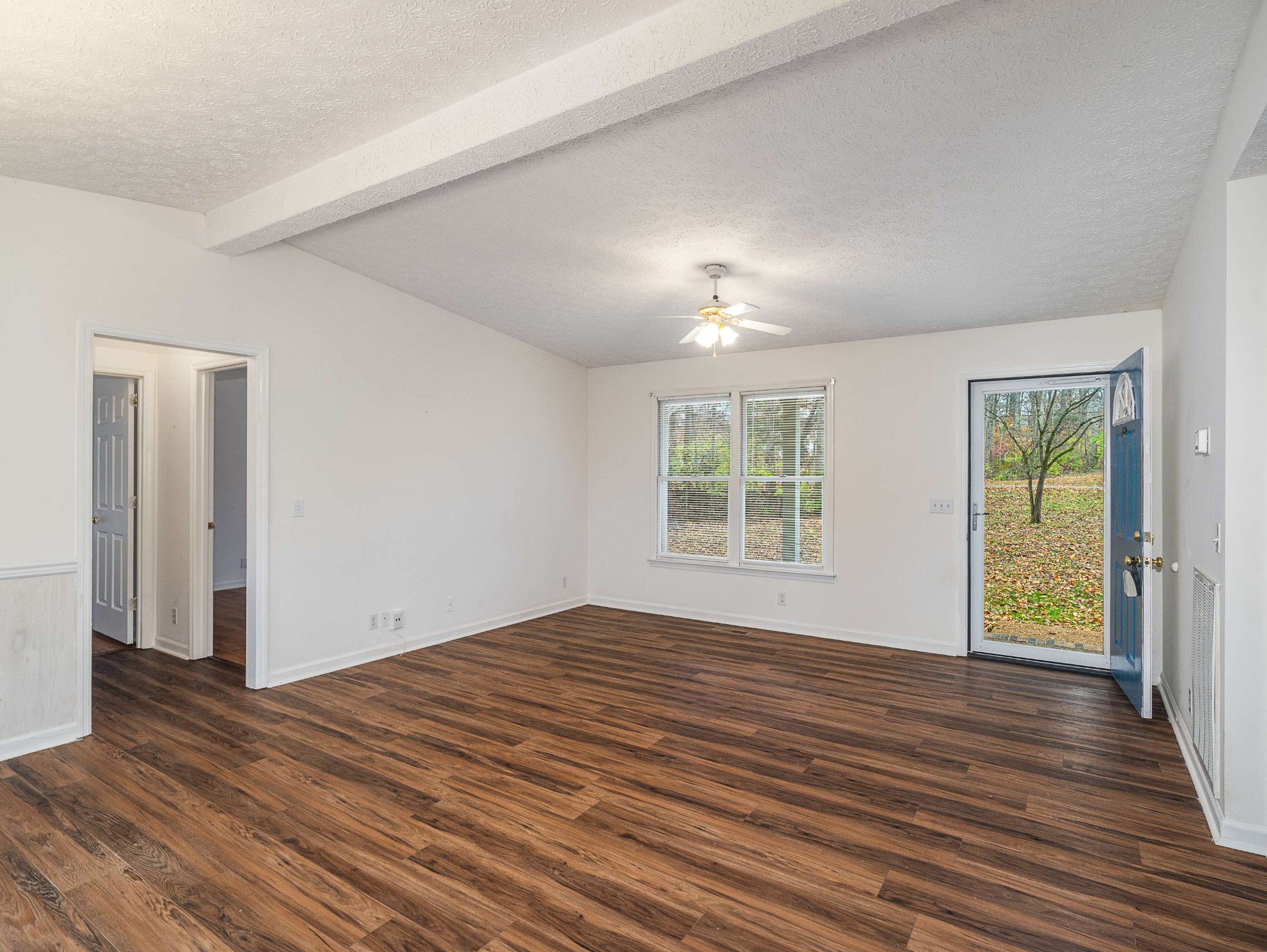 7125 Sutton Place Fairview, TN 37062 - Photo 12 of 36 an empty room with wooden floor and windows