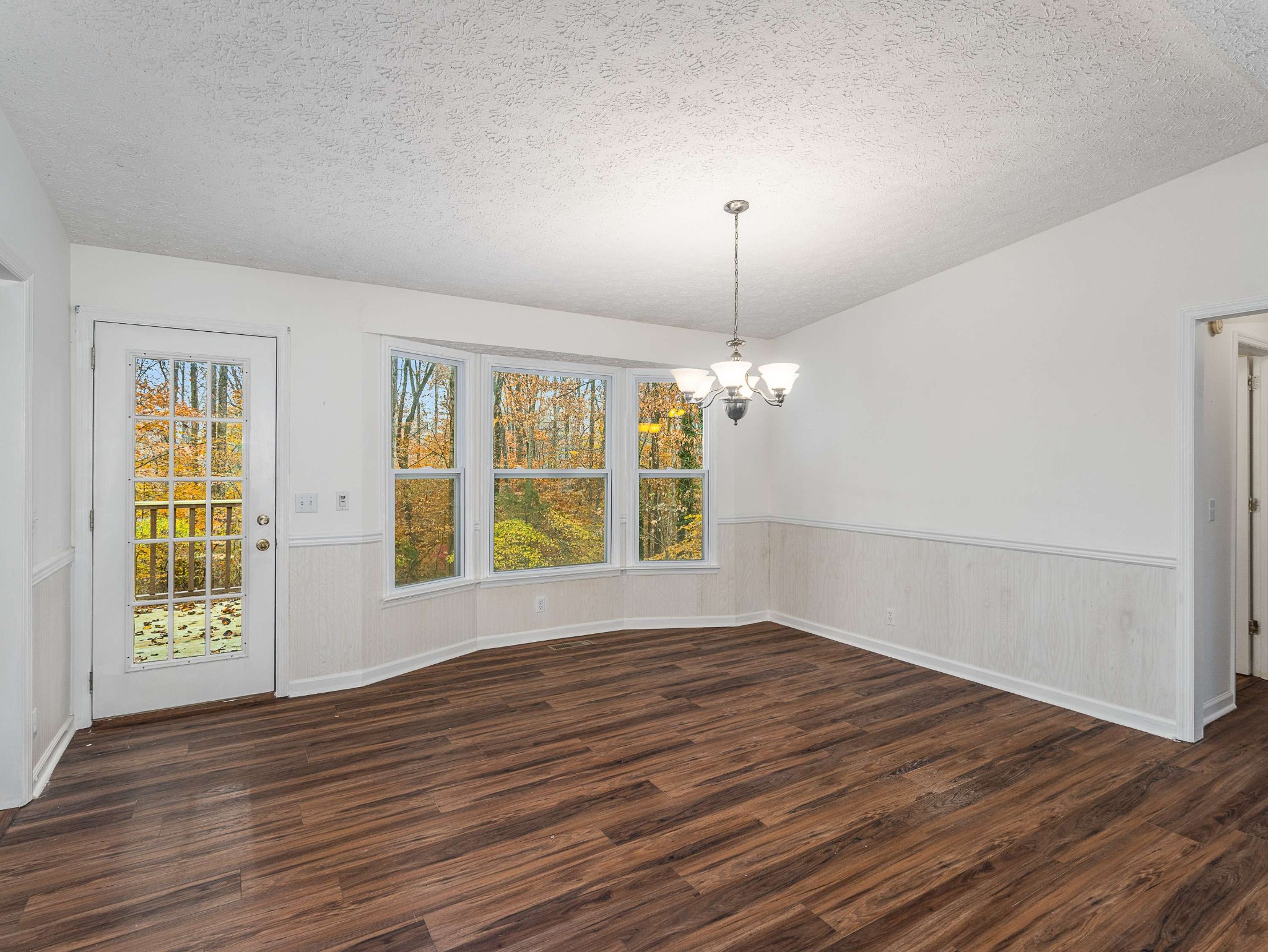 7125 Sutton Place Fairview, TN 37062 - Photo 13 of 36 a view of empty room with wooden floor and fan
