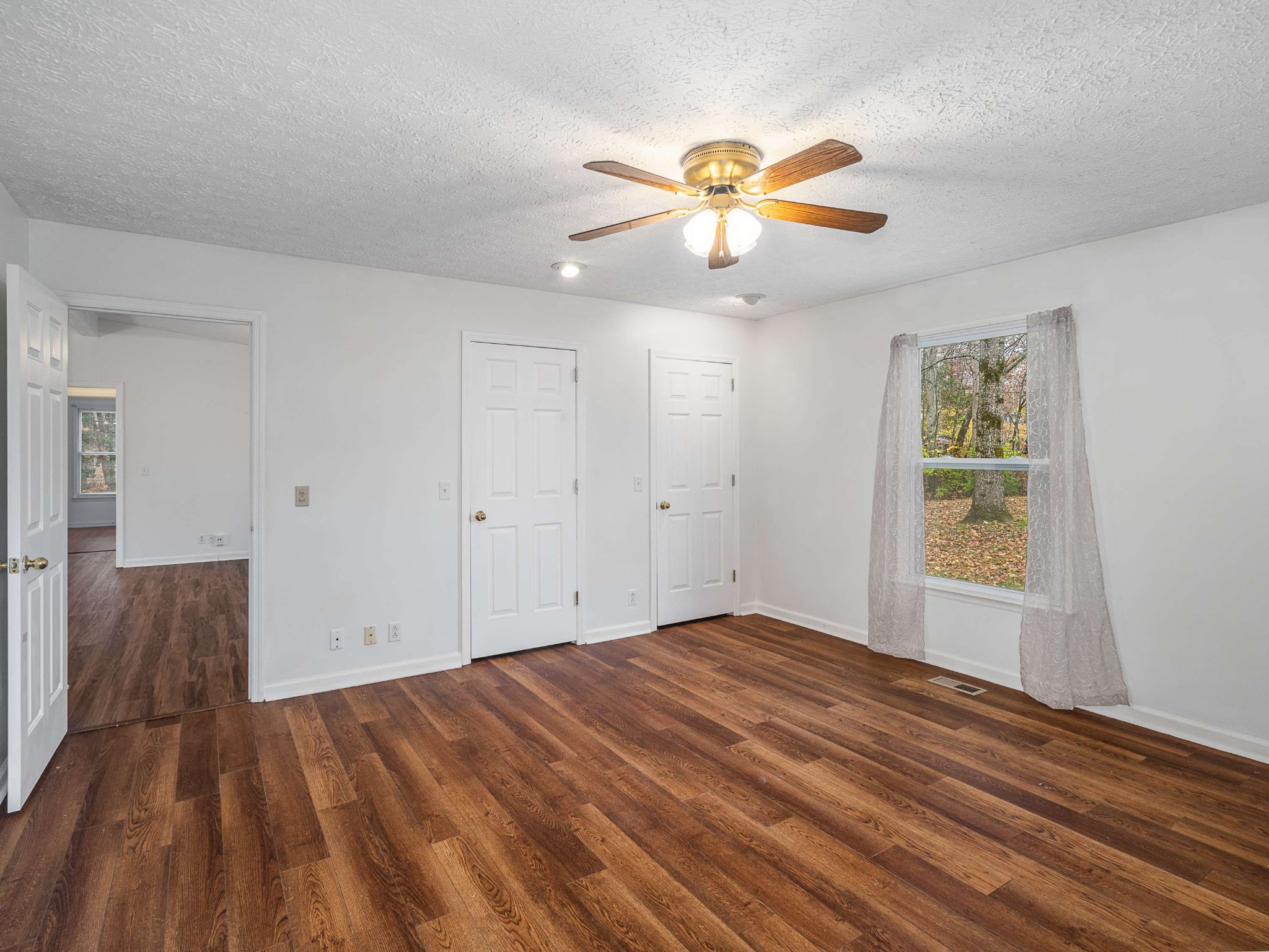 7125 Sutton Place Fairview, TN 37062 - Photo 21 of 36 a view of empty room with wooden floor and fan