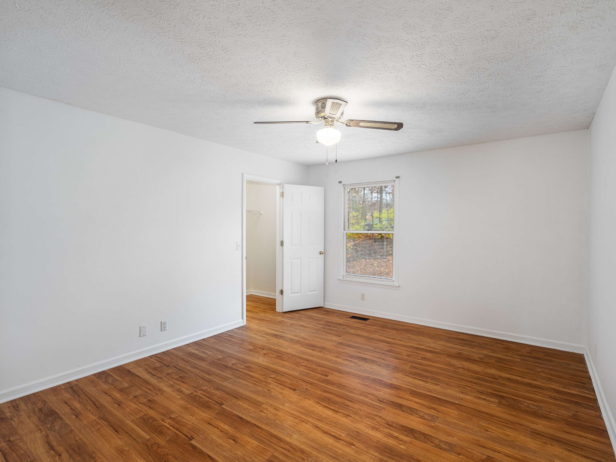 7125 Sutton Place Fairview, TN 37062 - Photo 27 of 36 wooden floor in an empty room with a window