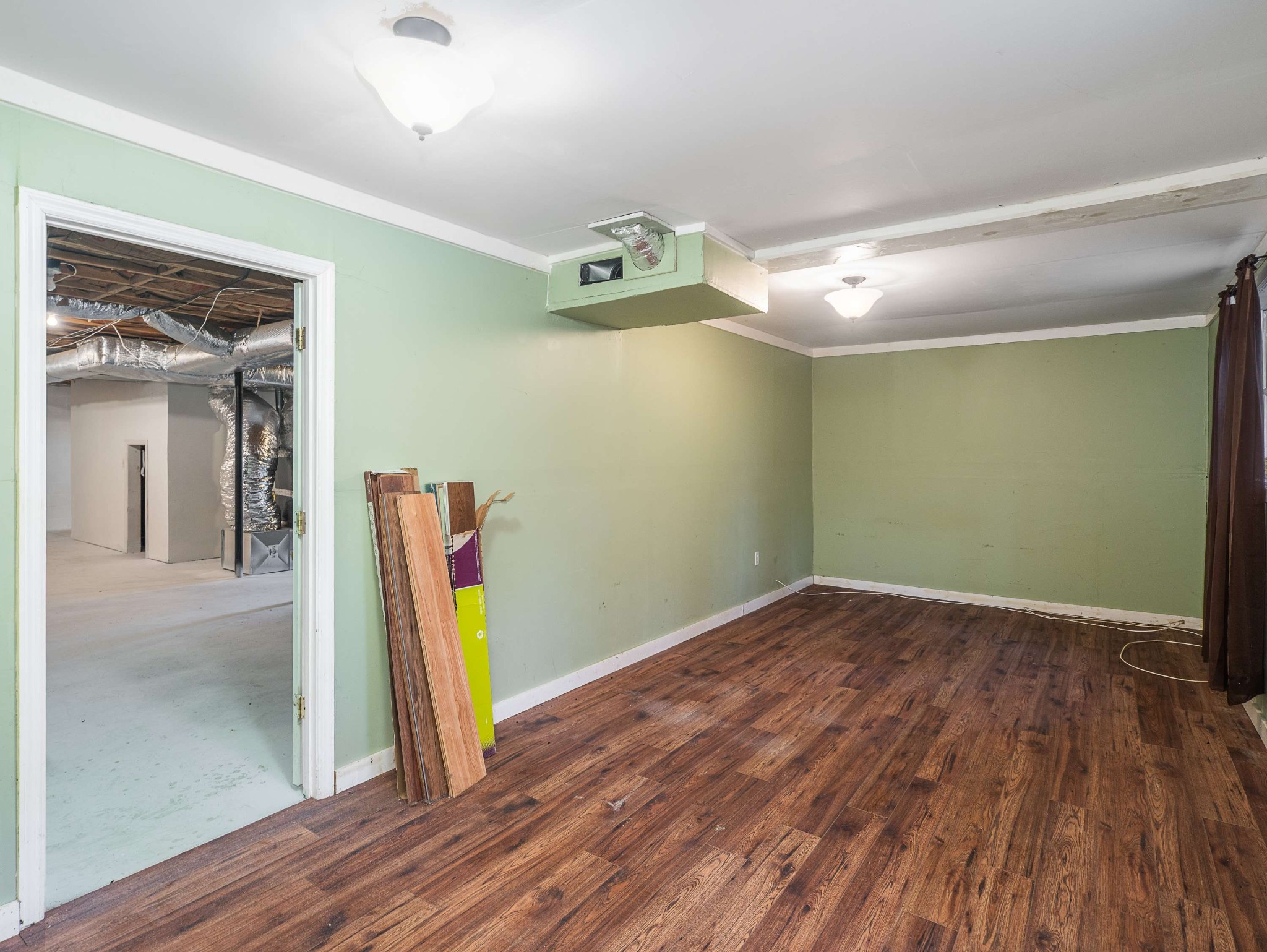 7125 Sutton Place Fairview, TN 37062 - Photo 29 of 36 a view of an empty room with wooden floor