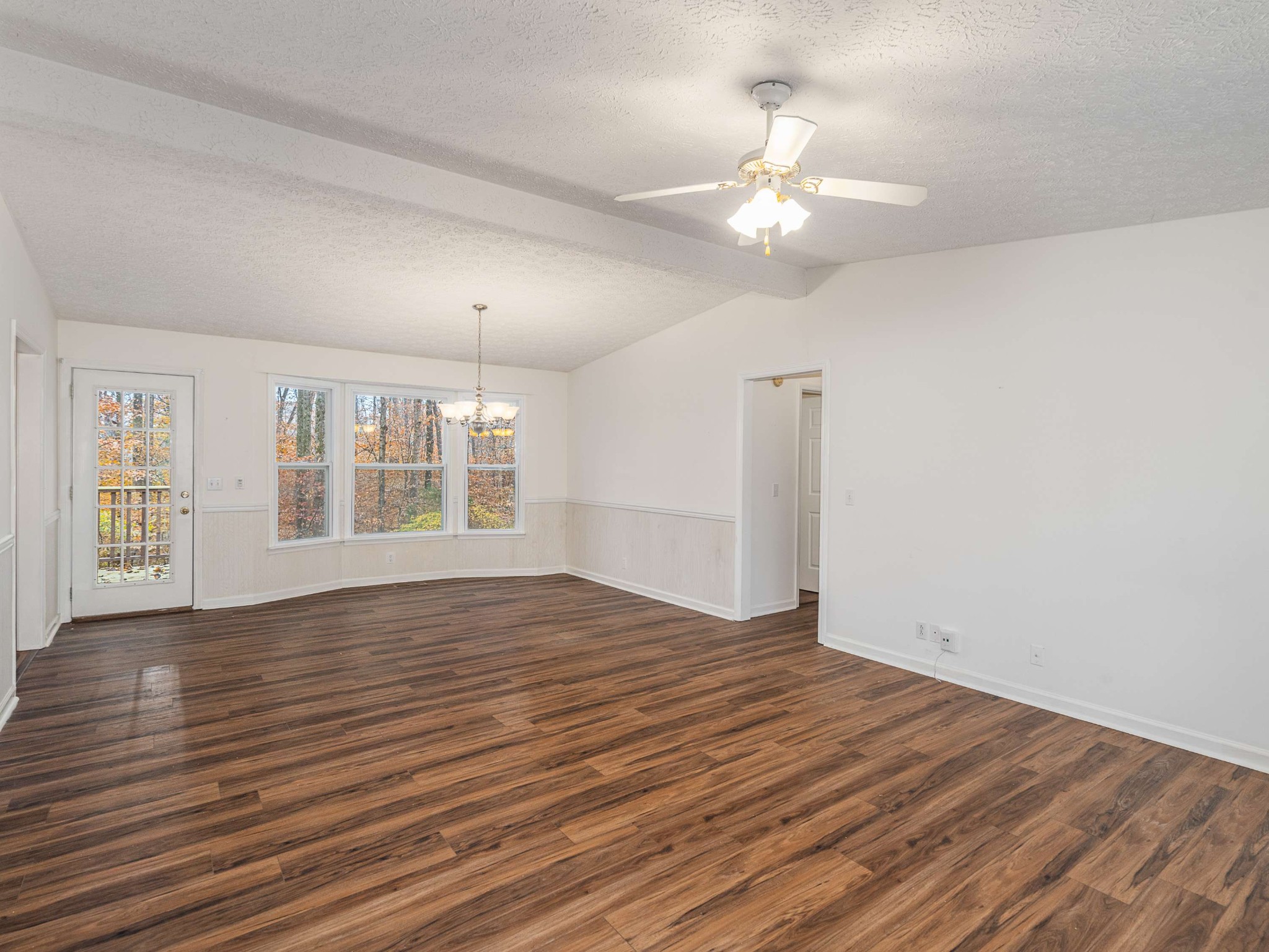 7125 Sutton Place Fairview, TN 37062 - Photo 9 of 36 a view of an empty room with wooden floor and a window