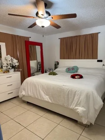 a bedroom with bed and window