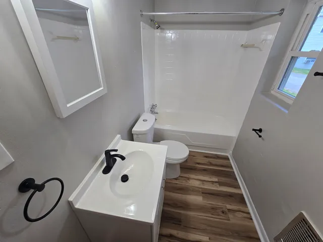 a bathroom with a sink and mirror