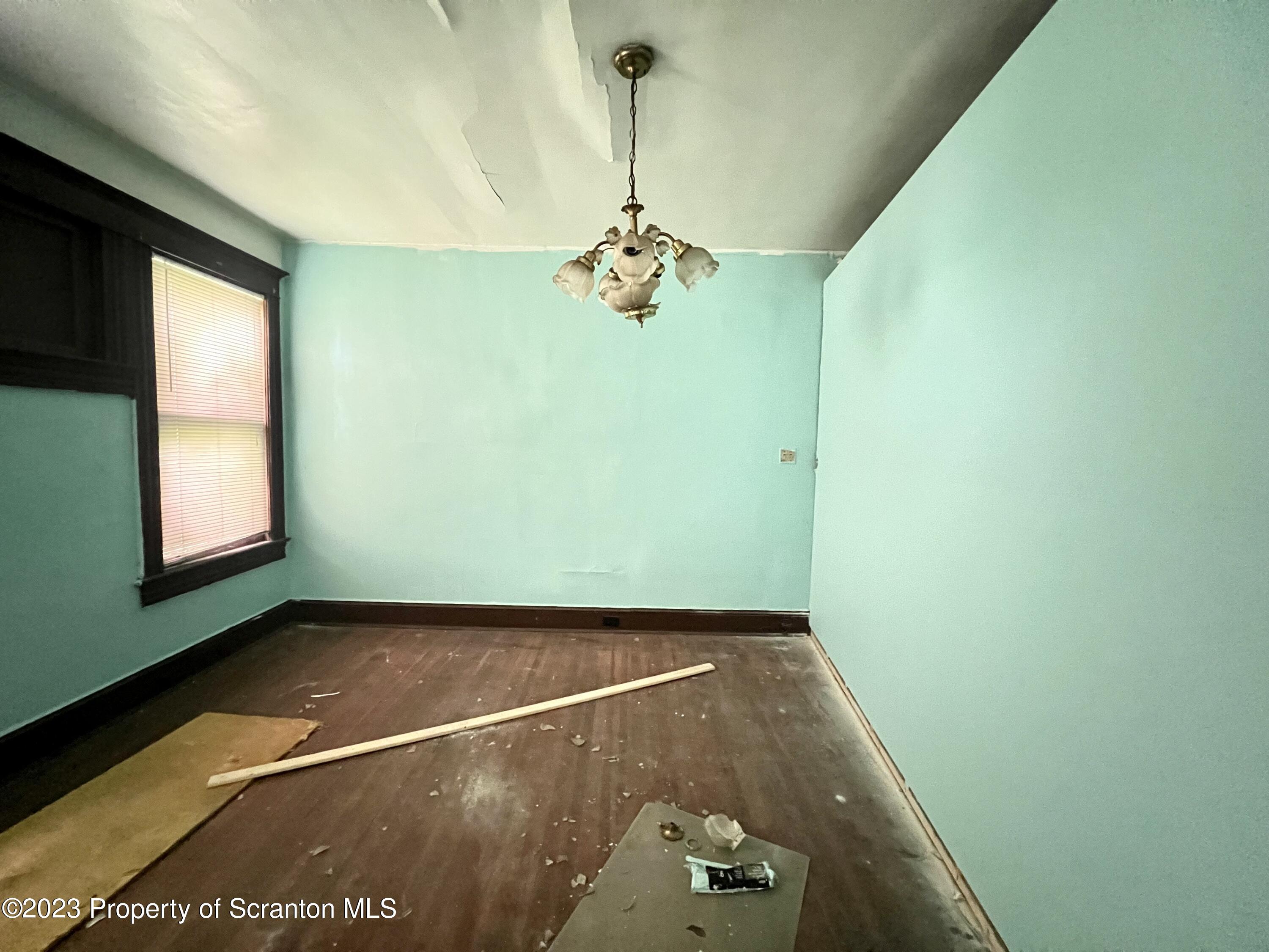 352-354 Maple Street Scranton, PA 18505 - Photo 5 of 22 a view of a room with gym equipment and windows