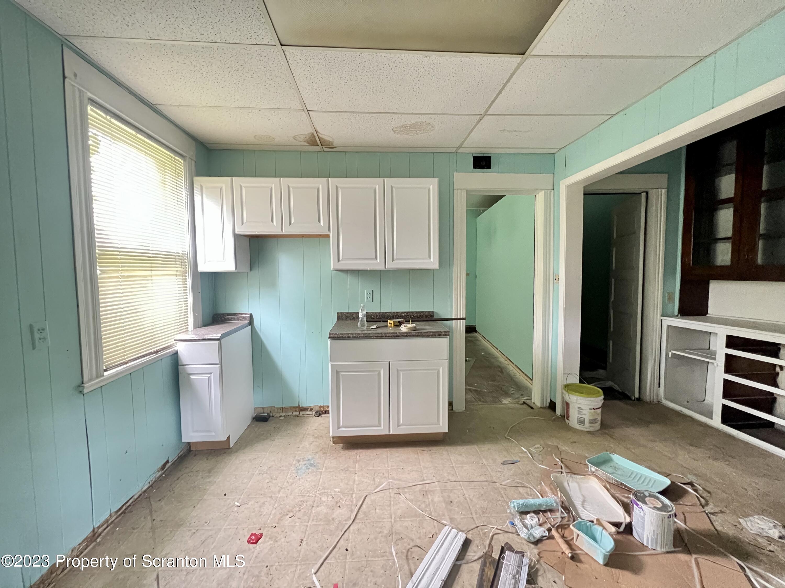 352-354 Maple Street Scranton, PA 18505 - Photo 6 of 22 a kitchen with a stove a sink and a refrigerator