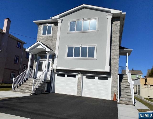 a front view of a house with stairs