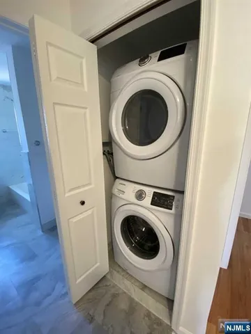 a view of a hallway with washer and dryer