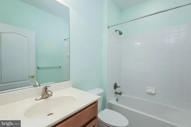 a bathroom with a sink toilet and bathtub