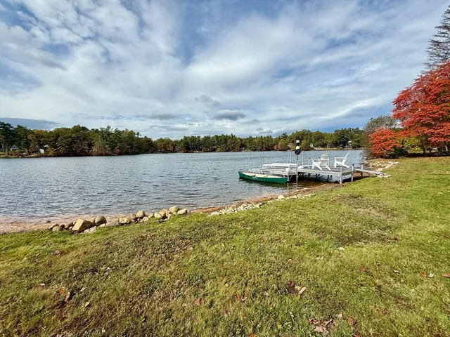 a view of a lake with houses in the back