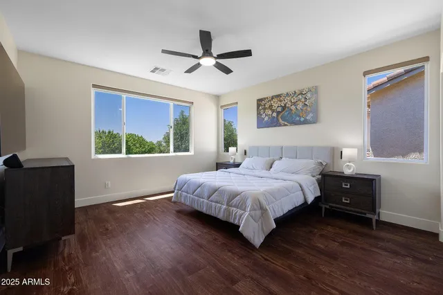 a bedroom with a large bed and a window