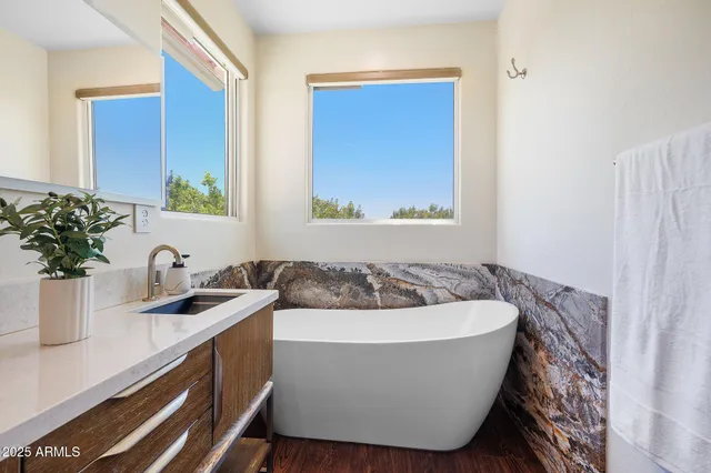 a white bath tub sitting in a bathroom