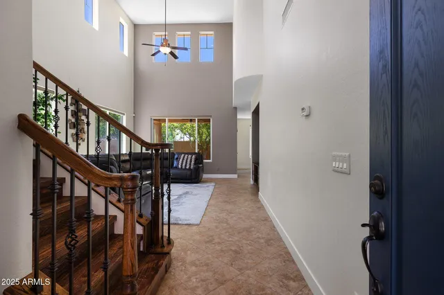 a view of a livingroom with furniture and stairs