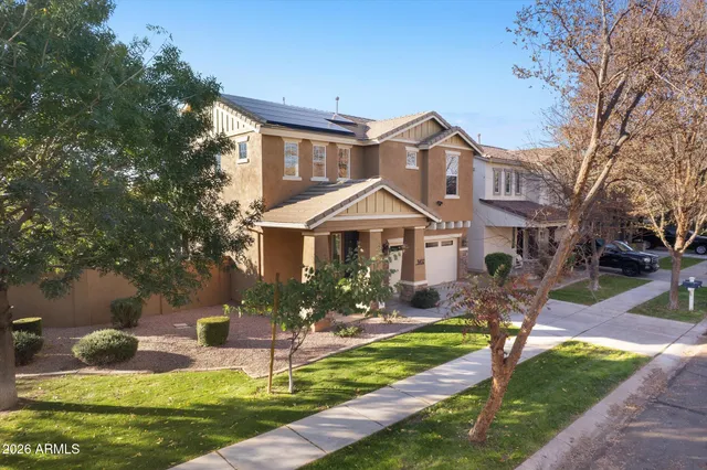 a kitchen with stainless steel appliances granite countertop a sink and a stove