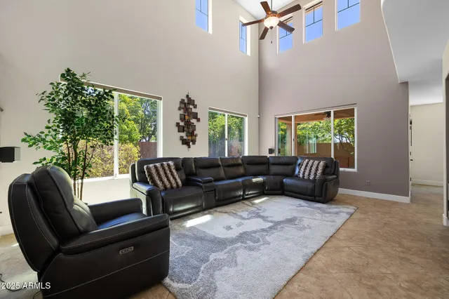 a kitchen with stainless steel appliances granite countertop wooden cabinets a stove top oven