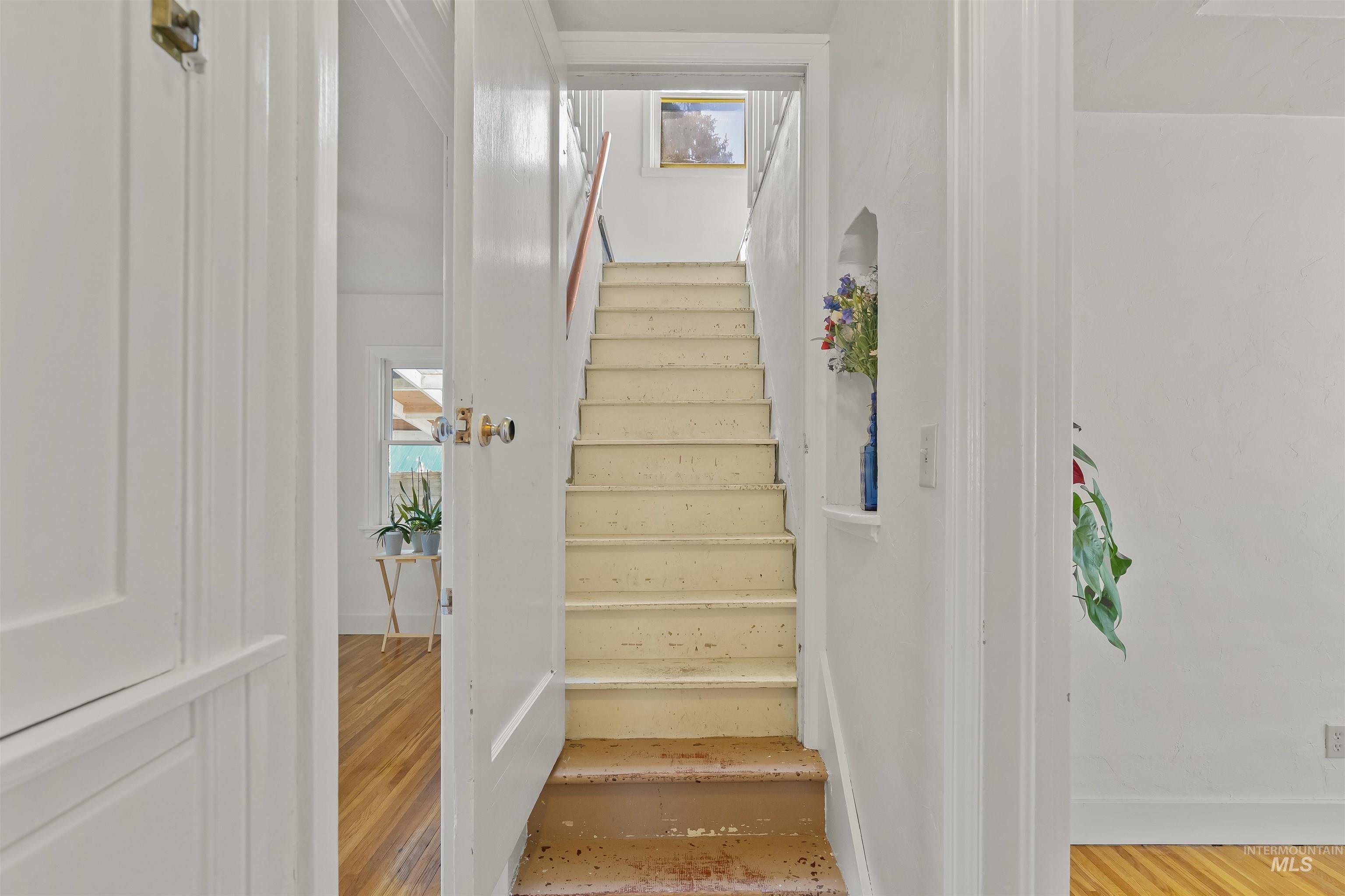 924 N Street Lewiston, ID 83501 - Photo 25 of 46 Staircase featuring wood handrail and integrated wall niche