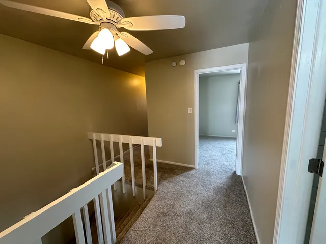 a view of entryway with a fan