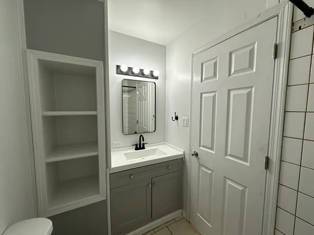 a bathroom with a shower and a toilet