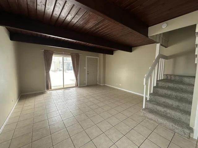 a view of an empty room with stairs