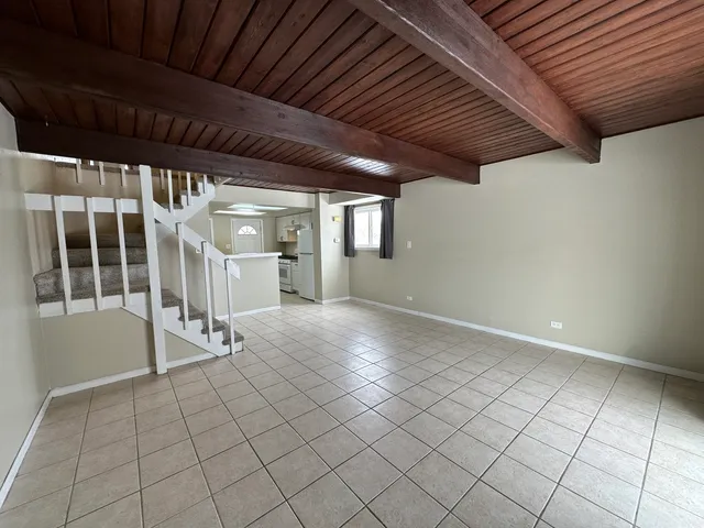 a view of an empty room with white walls