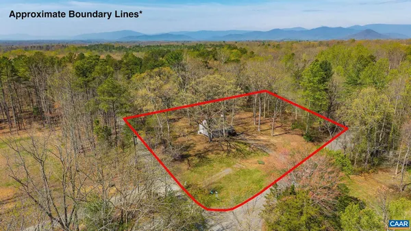 a view of a swimming pool with a yard