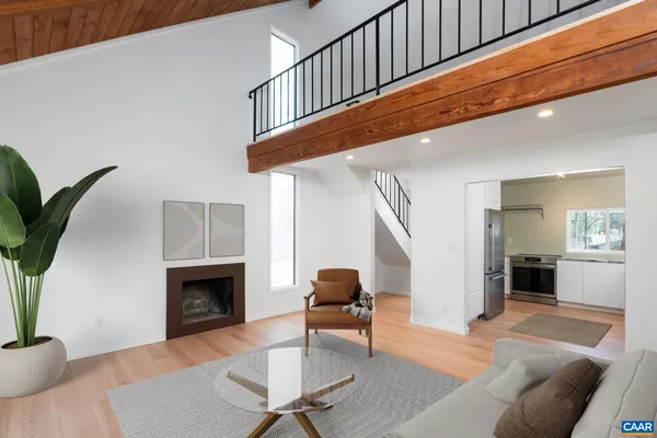 a view of a room with large trees