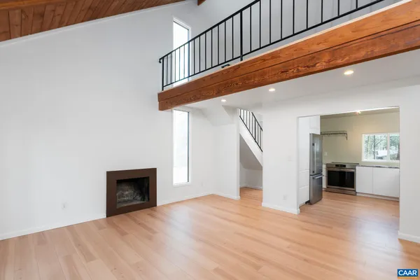 a view of an entryway with wooden floor