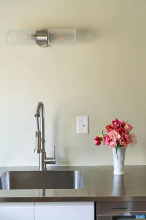 a bathroom sink with a granite countertop