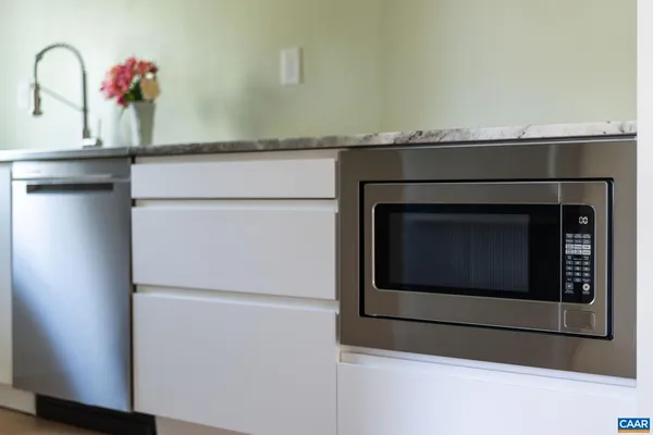 a kitchen with a stove and a microwave