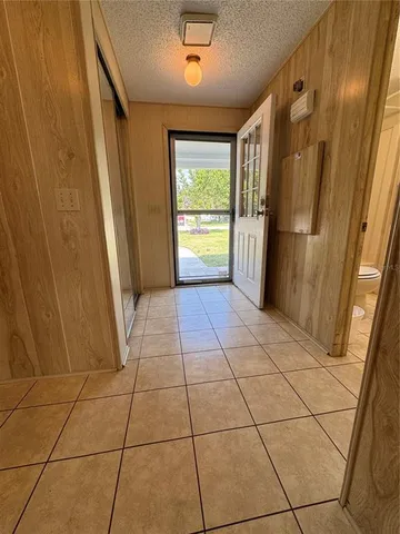 a sign that is sitting in front of flowers