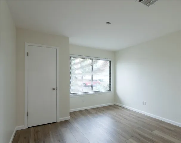 a view of kitchen with wooden floor and windows