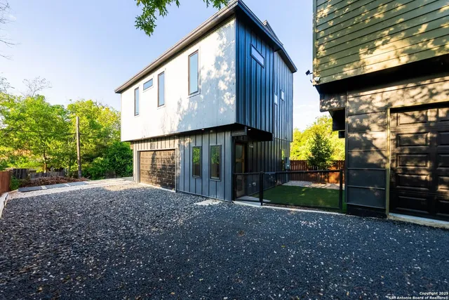 a view of a house with a yard and plants
