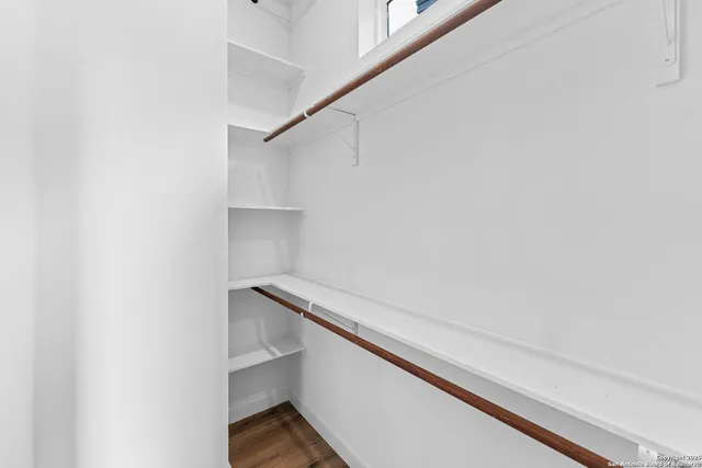 a view of a balcony with wooden floor