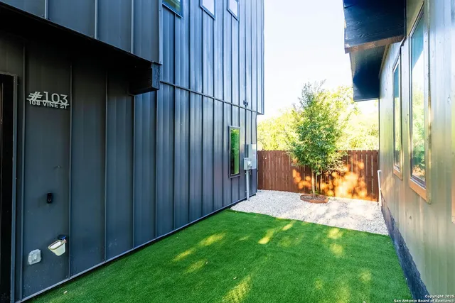 a view of a house with a tree