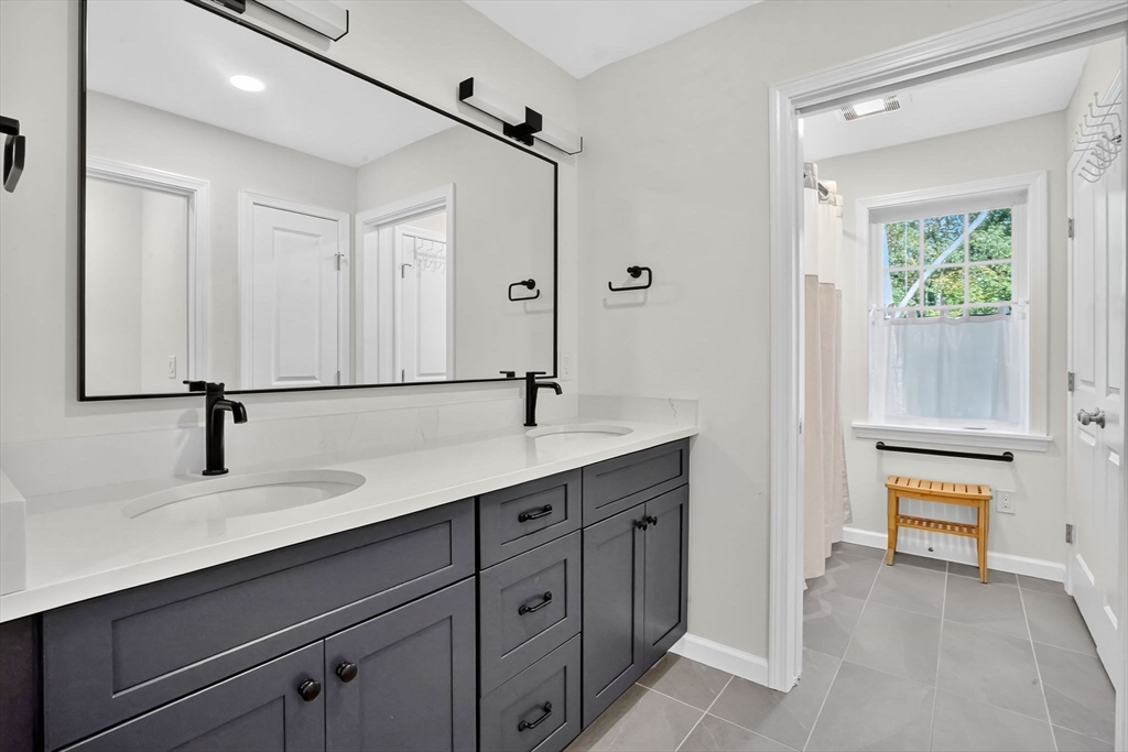 41 Dennis Road Longmeadow, MA 01106 - Photo 30 of 41 a bathroom with a sink and a mirror