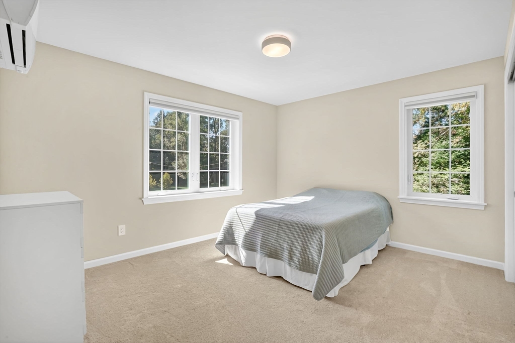 41 Dennis Road Longmeadow, MA 01106 - Photo 33 of 41 a spacious bedroom with a bed and next to a window