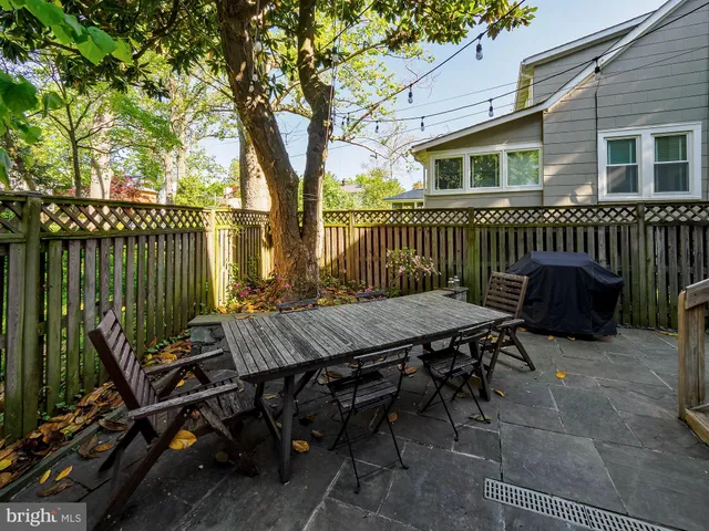 a house view with a sitting space and garden
