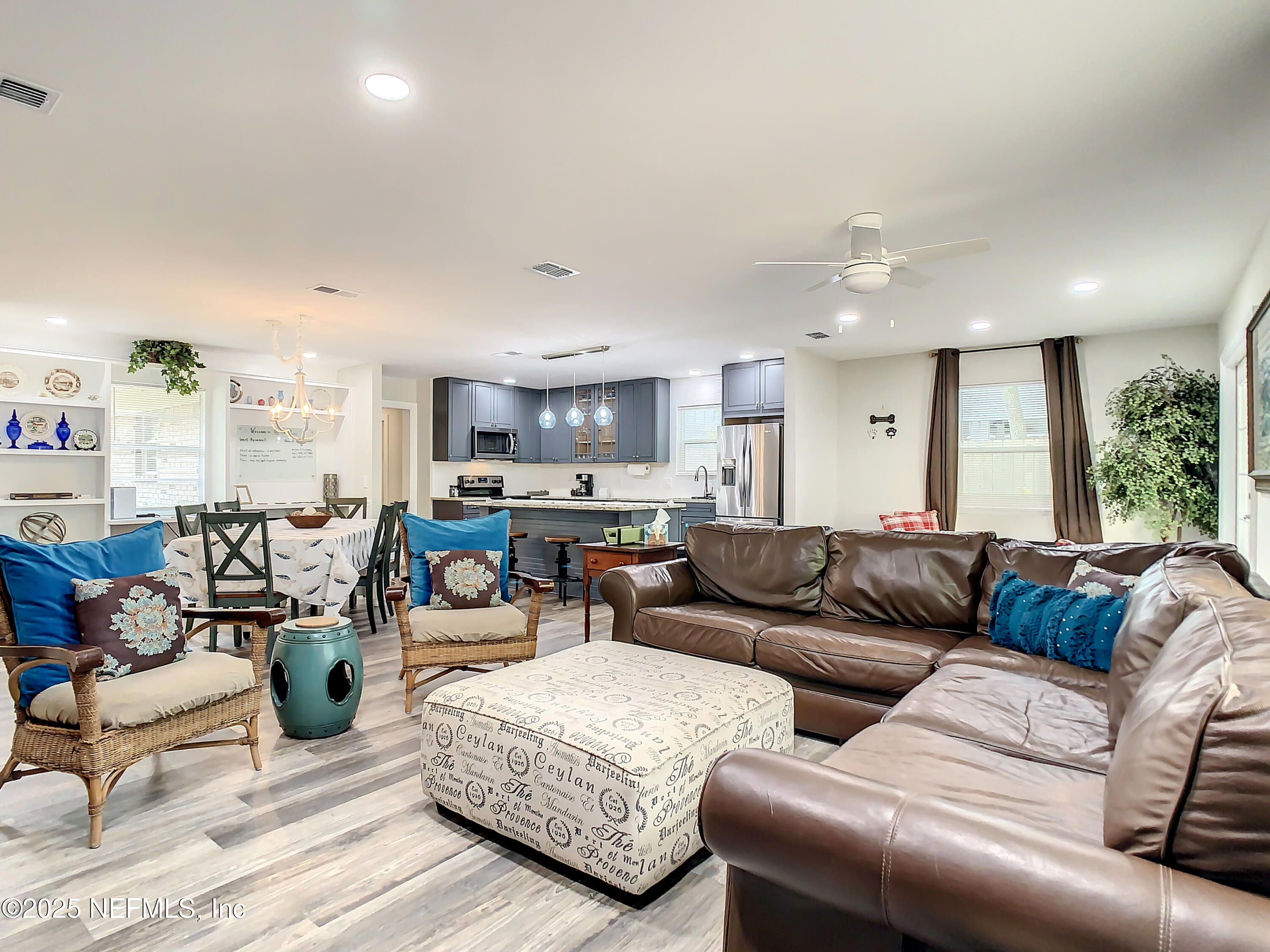 460 Lobelia Road St. Augustine, FL 32086 - Photo 13 of 34 a living room with furniture and a large window