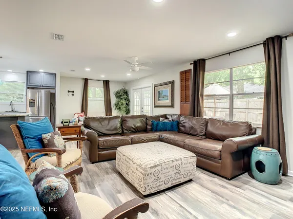 a living room with furniture and a large window