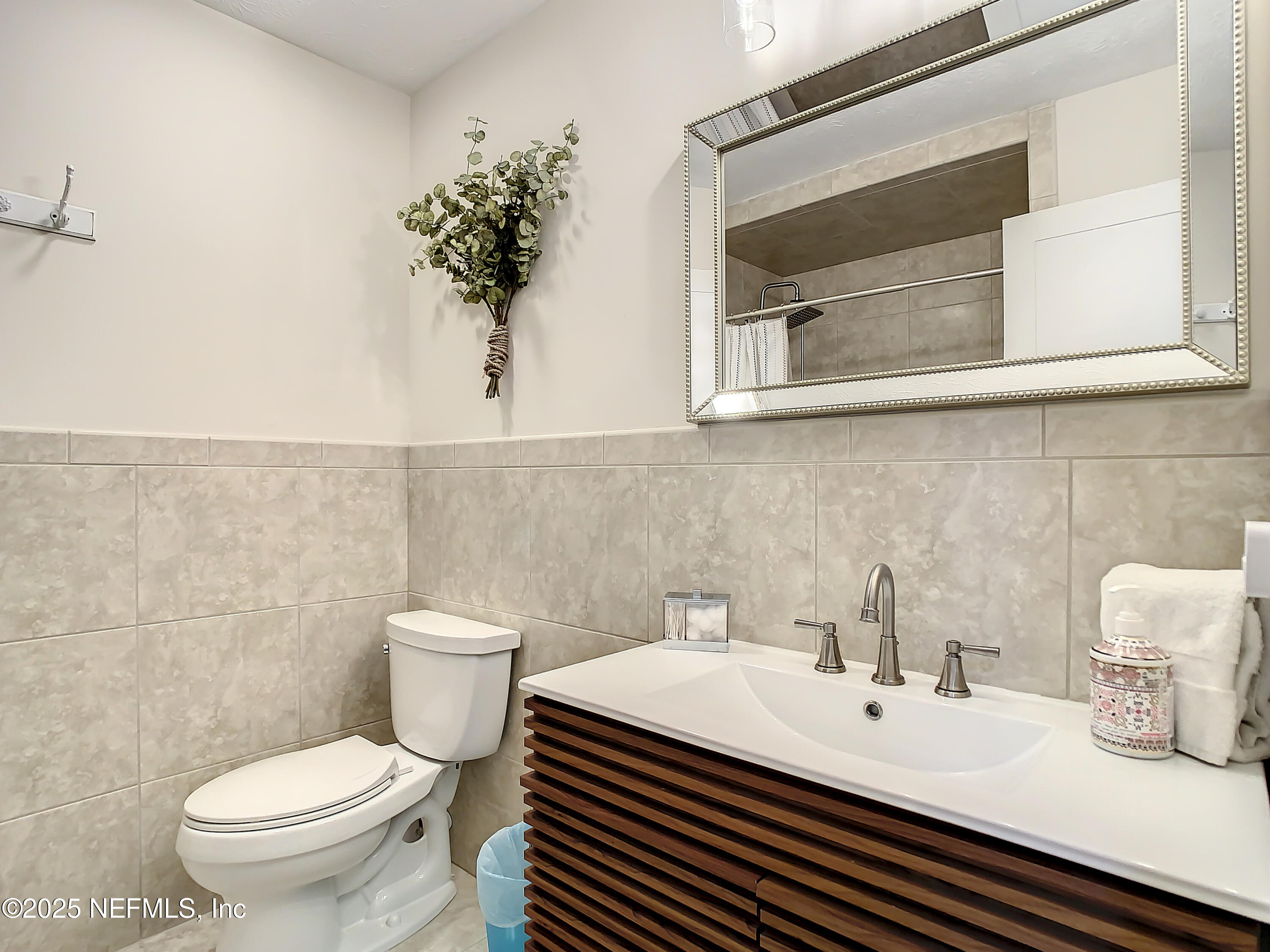 460 Lobelia Road St. Augustine, FL 32086 - Photo 24 of 34 a bathroom with a sink and a toilet