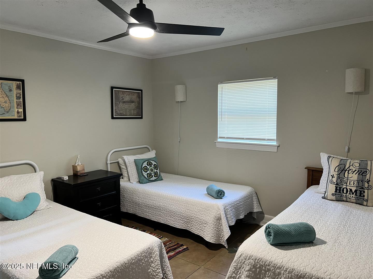 460 Lobelia Road St. Augustine, FL 32086 - Photo 26 of 34 a bedroom with two beds and a couch